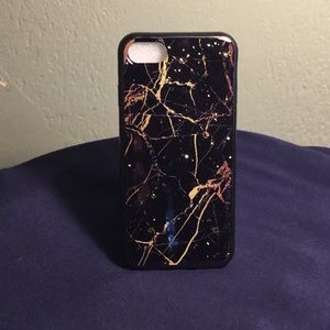 Black and gold iPhone case with gold flakes
